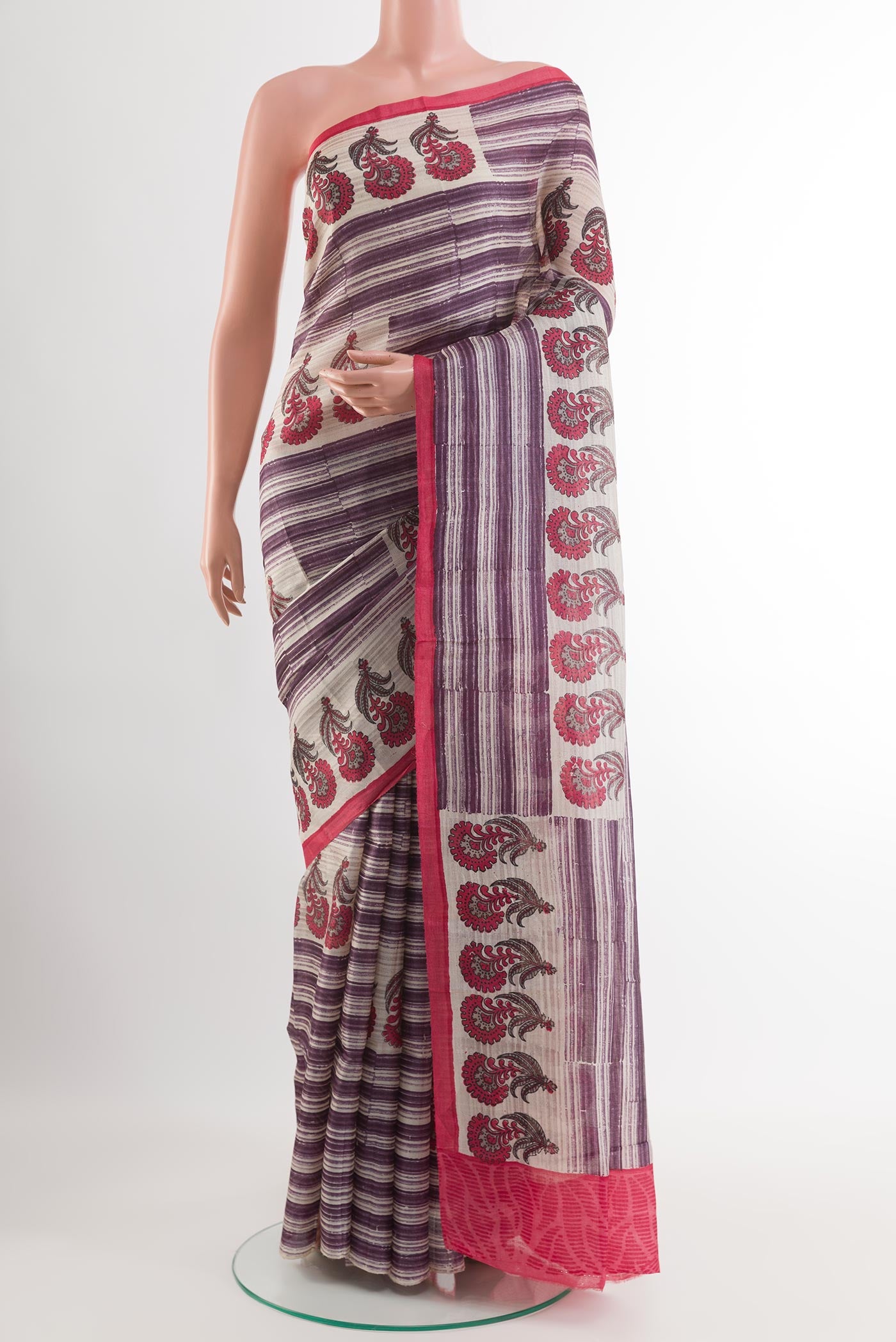 Purple Tussar Saree with Printed design on the body and Printed Border.  displayed on a mannequin
