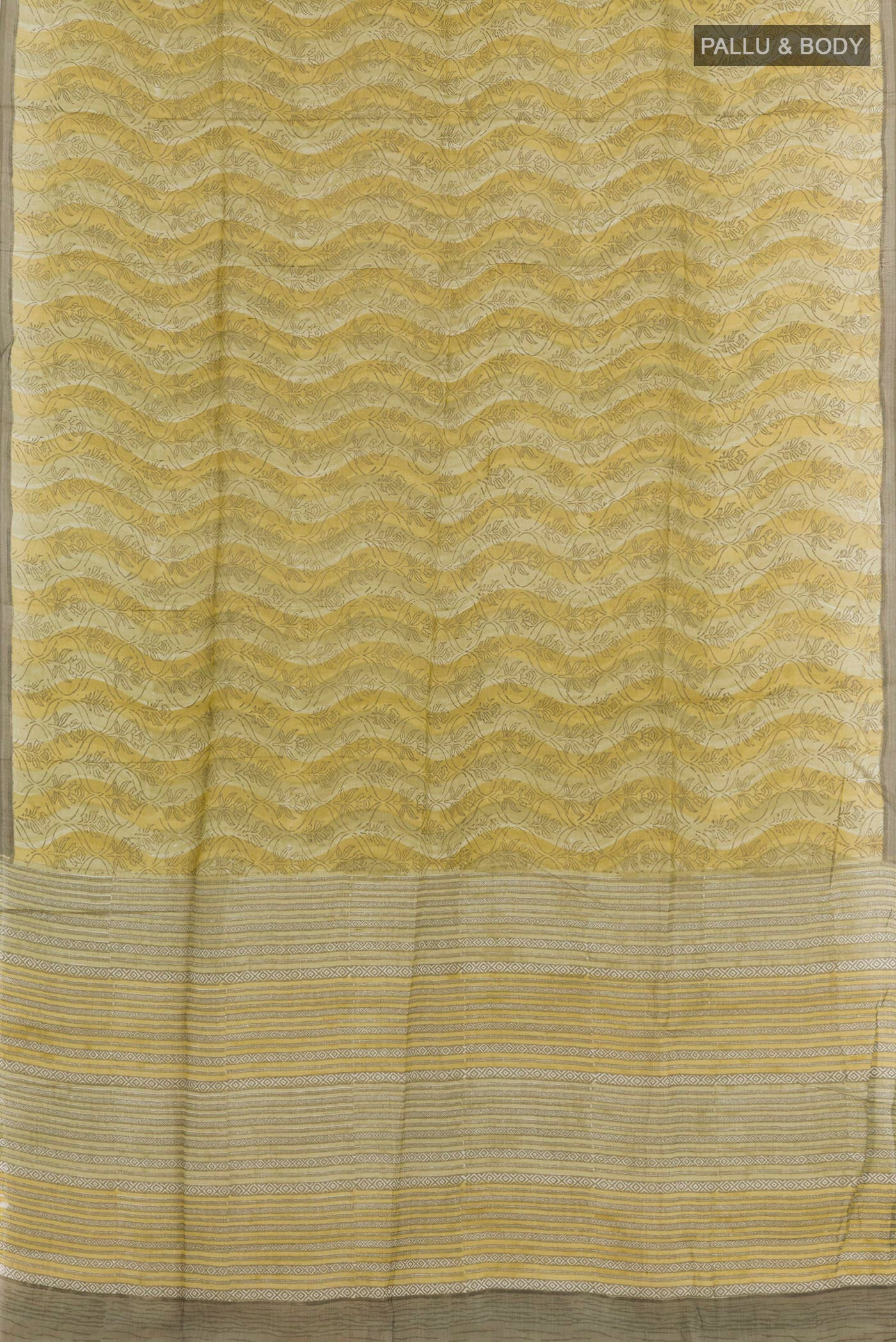 Flat view of Green Tussar Saree with Printed design on the body and Printed Border. 