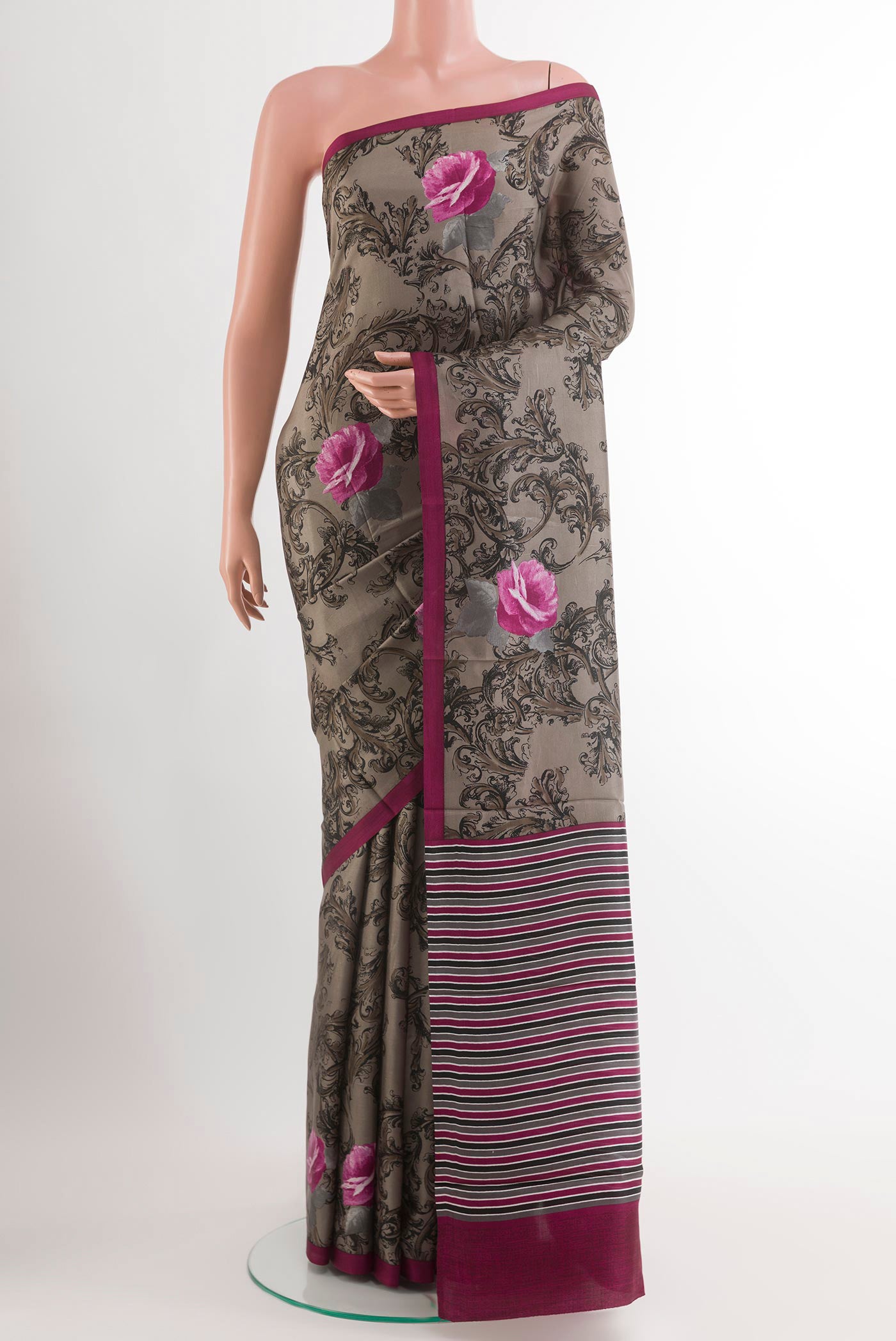 Grey Printed Silk Saree with Printed design on the body and Plain Border.  displayed on a mannequin