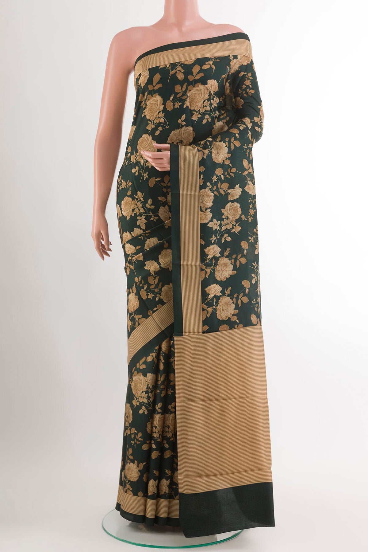 Bottle Green Printed Silk Saree with Printed design on the body and Plain Border.  displayed on a mannequin