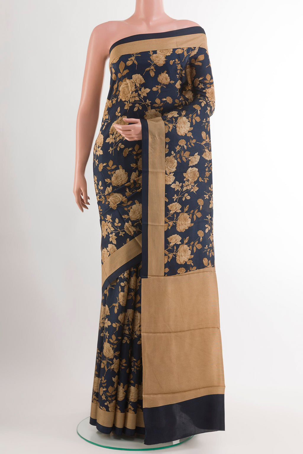 Dark Blue Printed Silk Saree with Printed design on the body and Plain Border.  displayed on a mannequin