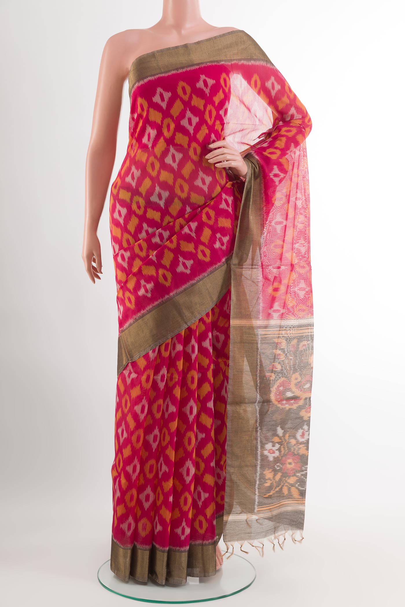 Pink Blended Kora Cotton Saree with Ikat design on the body and Zari Border.  displayed on a mannequin