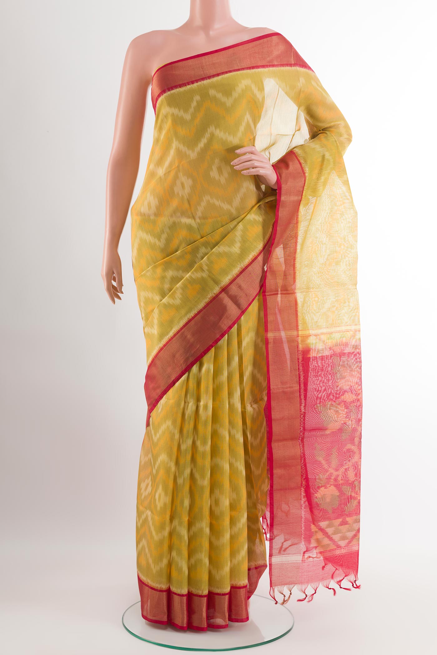 Yellow Blended Kora Cotton Saree with Ikat design on the body and Zari Border.  displayed on a mannequin