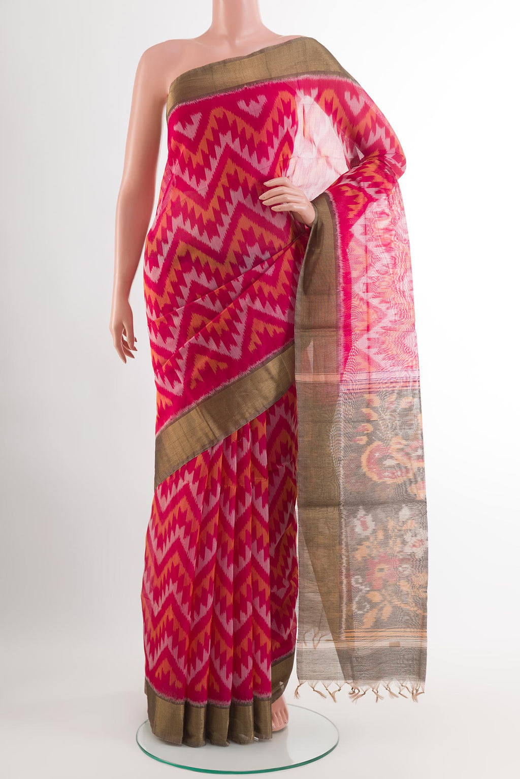 Pink Blended Kora Cotton Saree with Ikat design on the body and Zari Border.  displayed on a mannequin