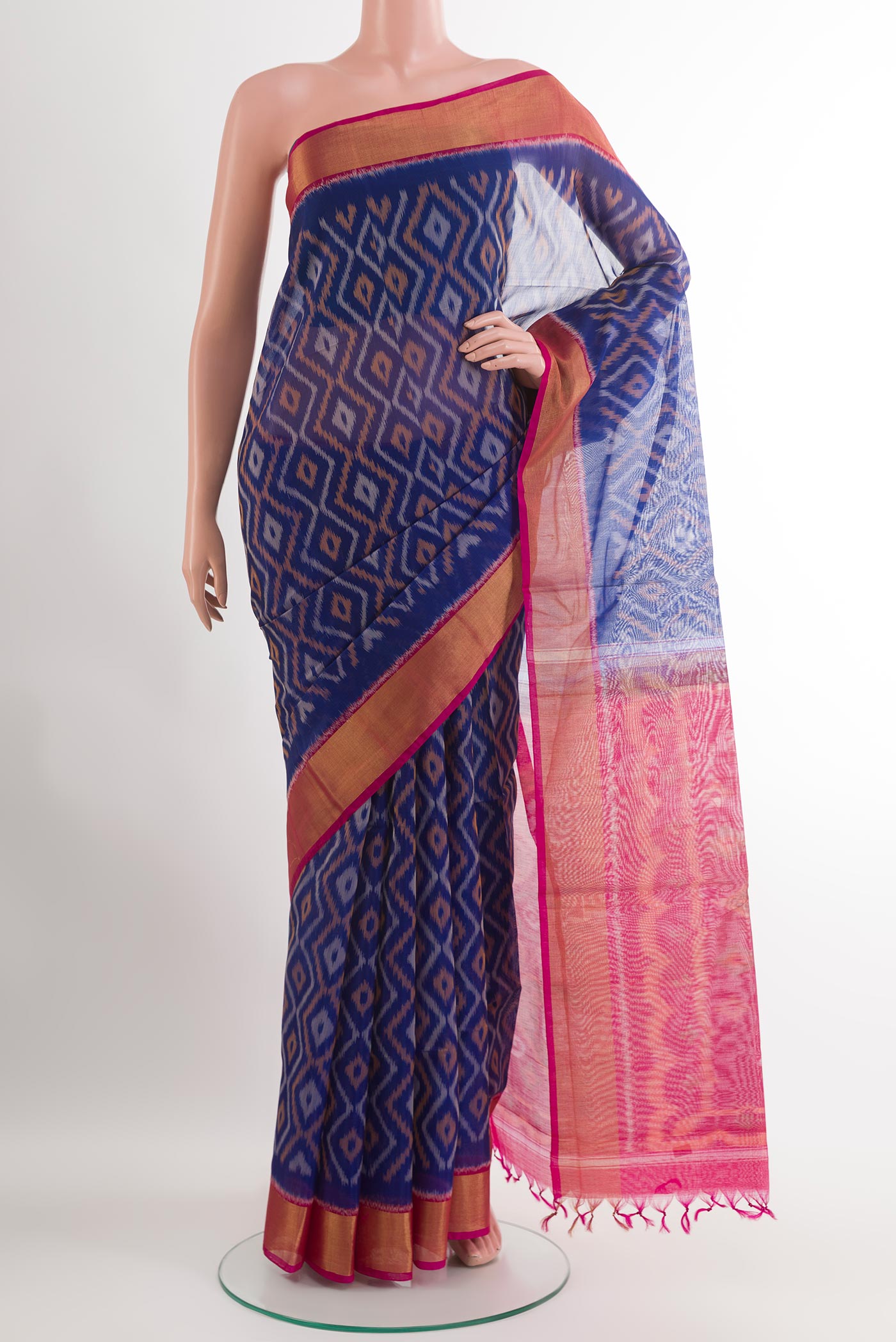 Blue Blended Kora Cotton Saree with Ikat design on the body and Zari Border.  displayed on a mannequin