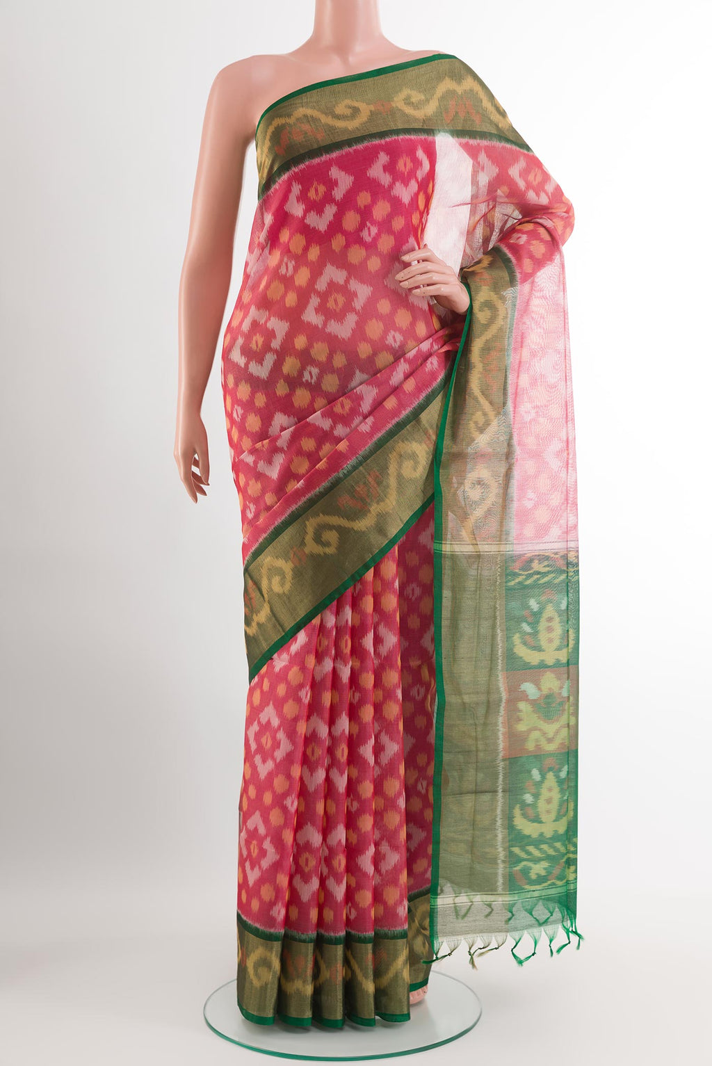 Pink Blended Kora Cotton Saree with Ikat design on the body and Zari Border.  displayed on a mannequin