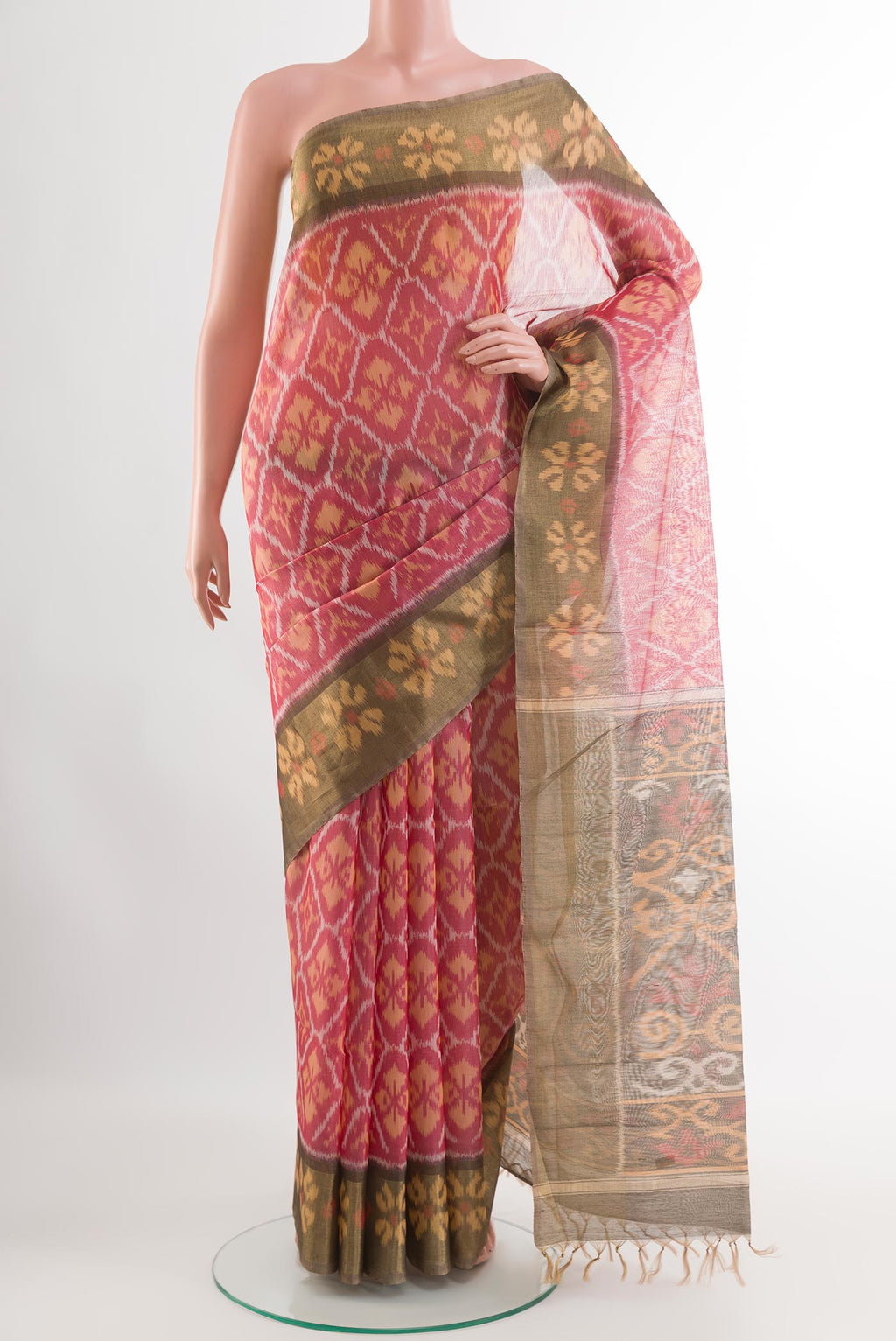 Red Blended Kora Cotton Saree with Ikat design on the body and Zari Border.  displayed on a mannequin
