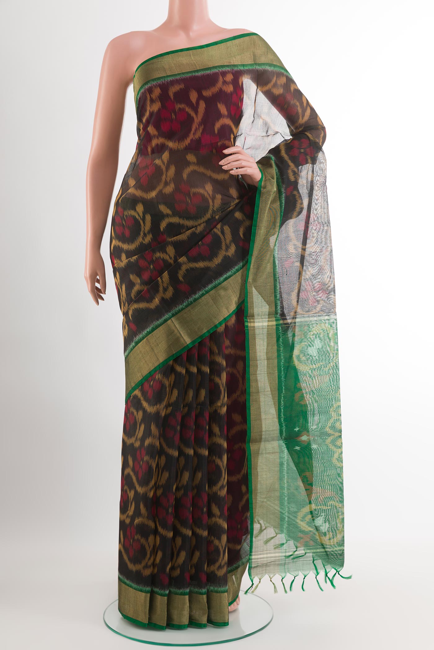 Black Blended Kora Cotton Saree with Ikat design on the body and Zari Border.  displayed on a mannequin