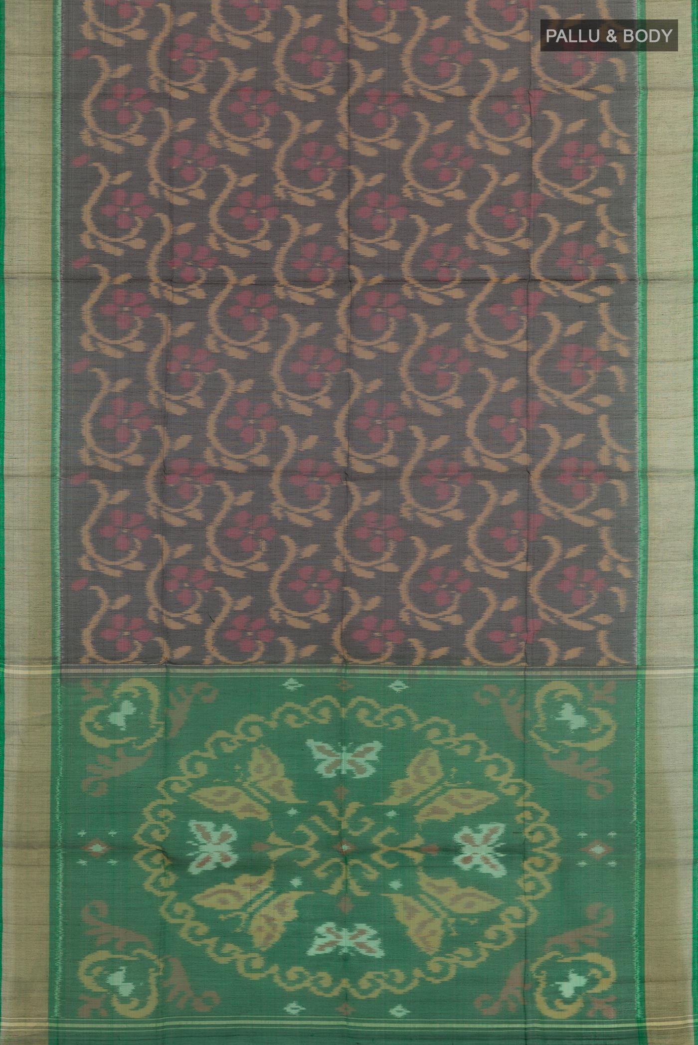 Flat view of Black Blended Kora Cotton Saree with Ikat design on the body and Zari Border. 