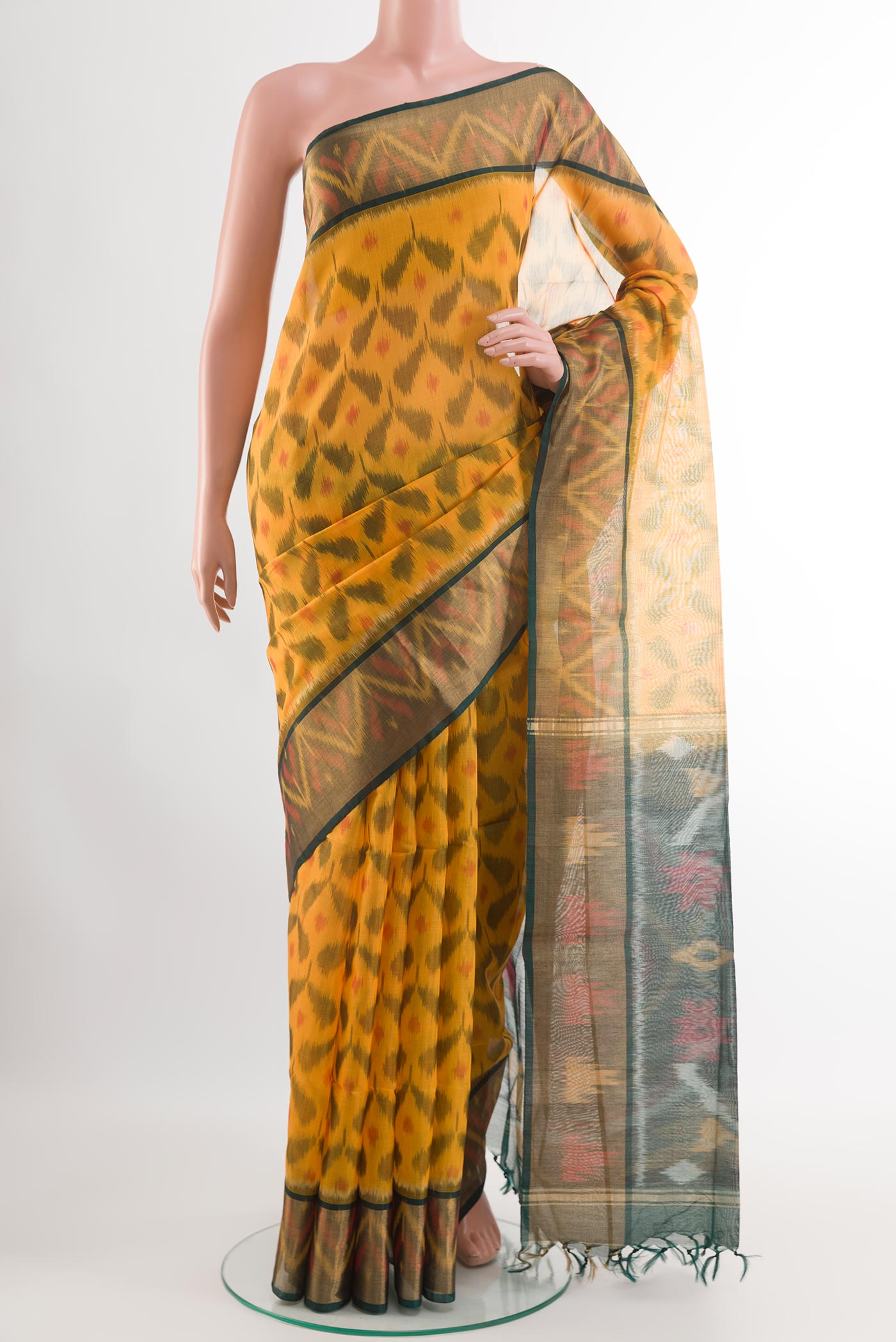 Yellow Blended Kora Cotton Saree with Ikat design on the body and Zari Border.  displayed on a mannequin
