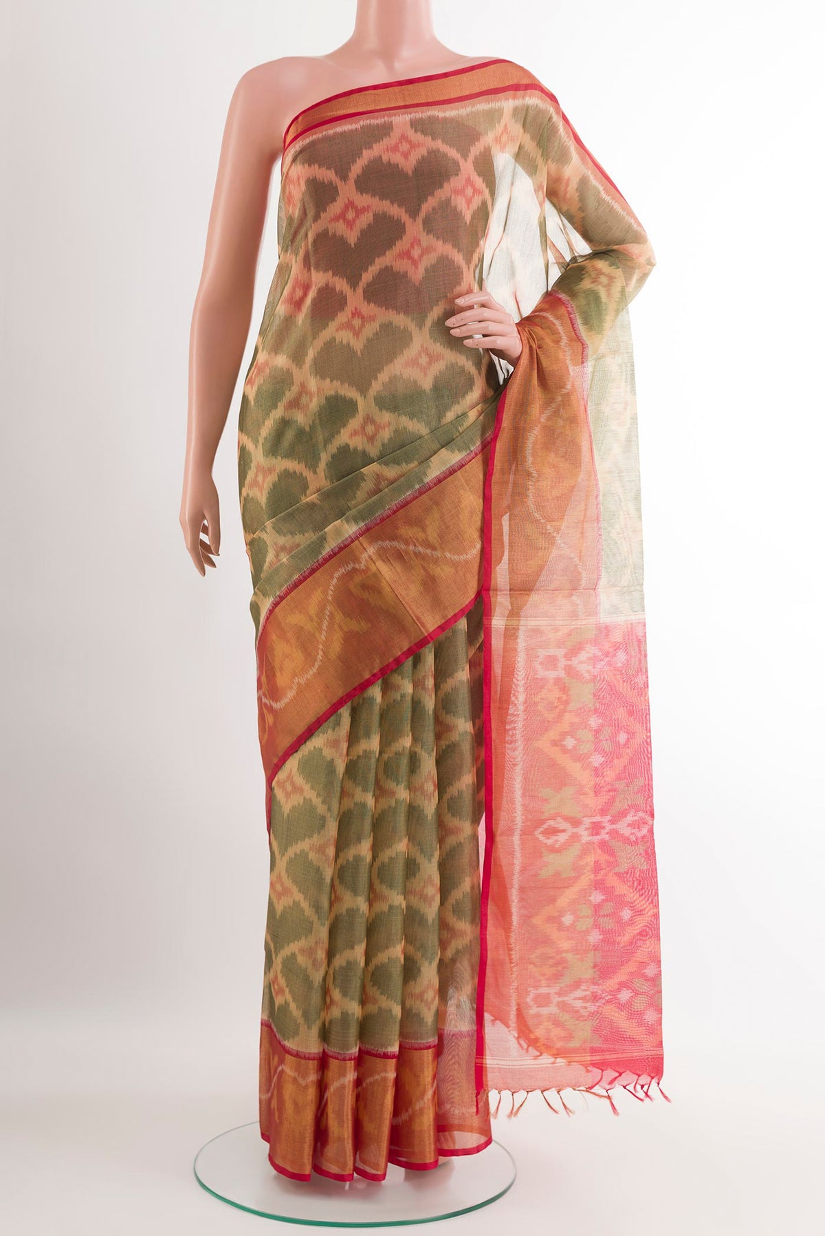 Beige Kora Cotton Saree with Ikat design on the body and Zari Border.  displayed on a mannequin