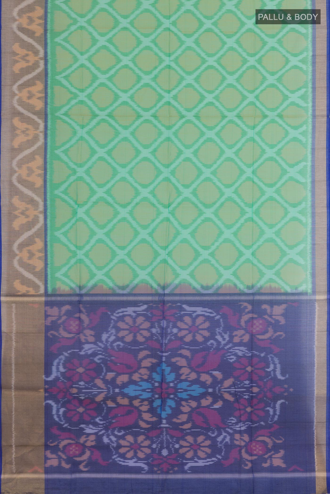 Flat view of Green Blended Kora Cotton Saree with Ikat design on the body and Zari Border. 