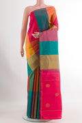 Multi Color Kanchipuram Silk Saree with Zari Butta on the body and Zari Border.  displayed on a mannequin