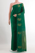 Green Kanchipuram Silk Saree with Zari Brocade on the body and Zari Border.  displayed on a mannequin