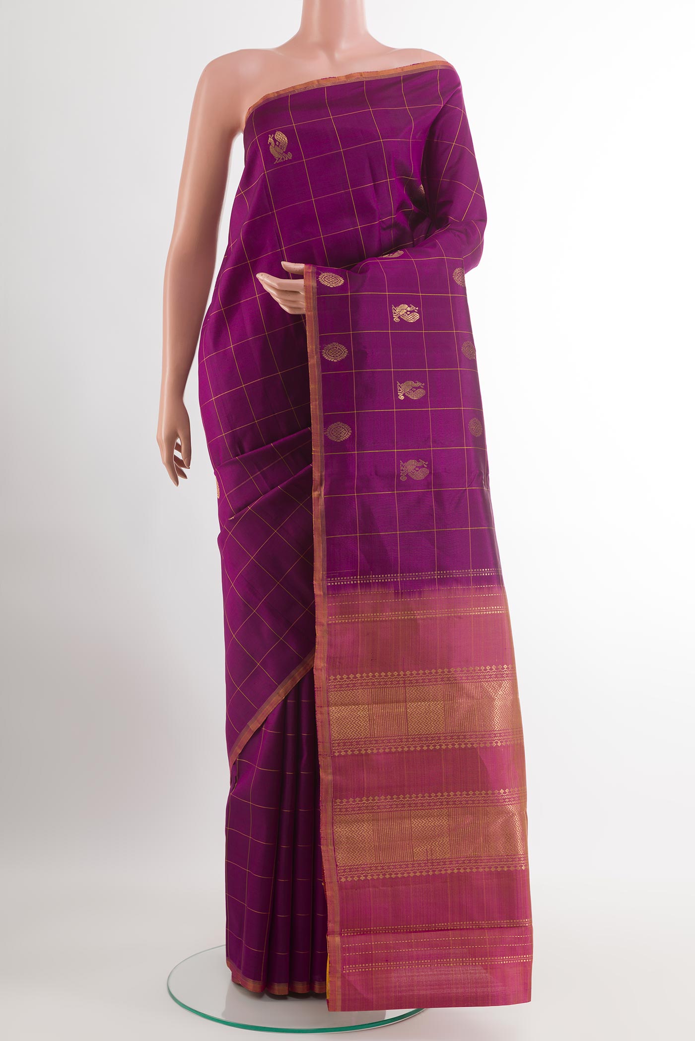Purple Kanchipuram Silk Saree with Zari Butta on the body and Zari Border.  displayed on a mannequin
