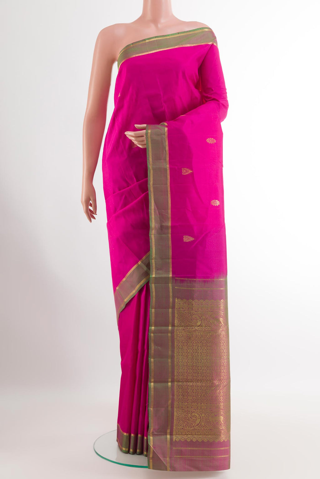 Pink Kanchipuram Silk Saree with Zari Butta on the body and Zari Border.  displayed on a mannequin