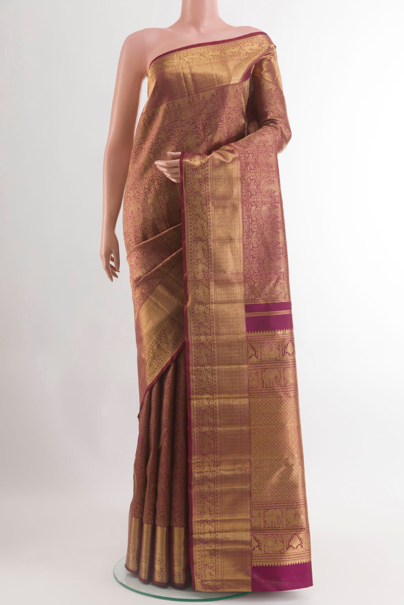 Pure Silk Pure Zari Maroon Kanjivaram Saree with Zari Brocade on the body and Zari Border.  displayed on a mannequin