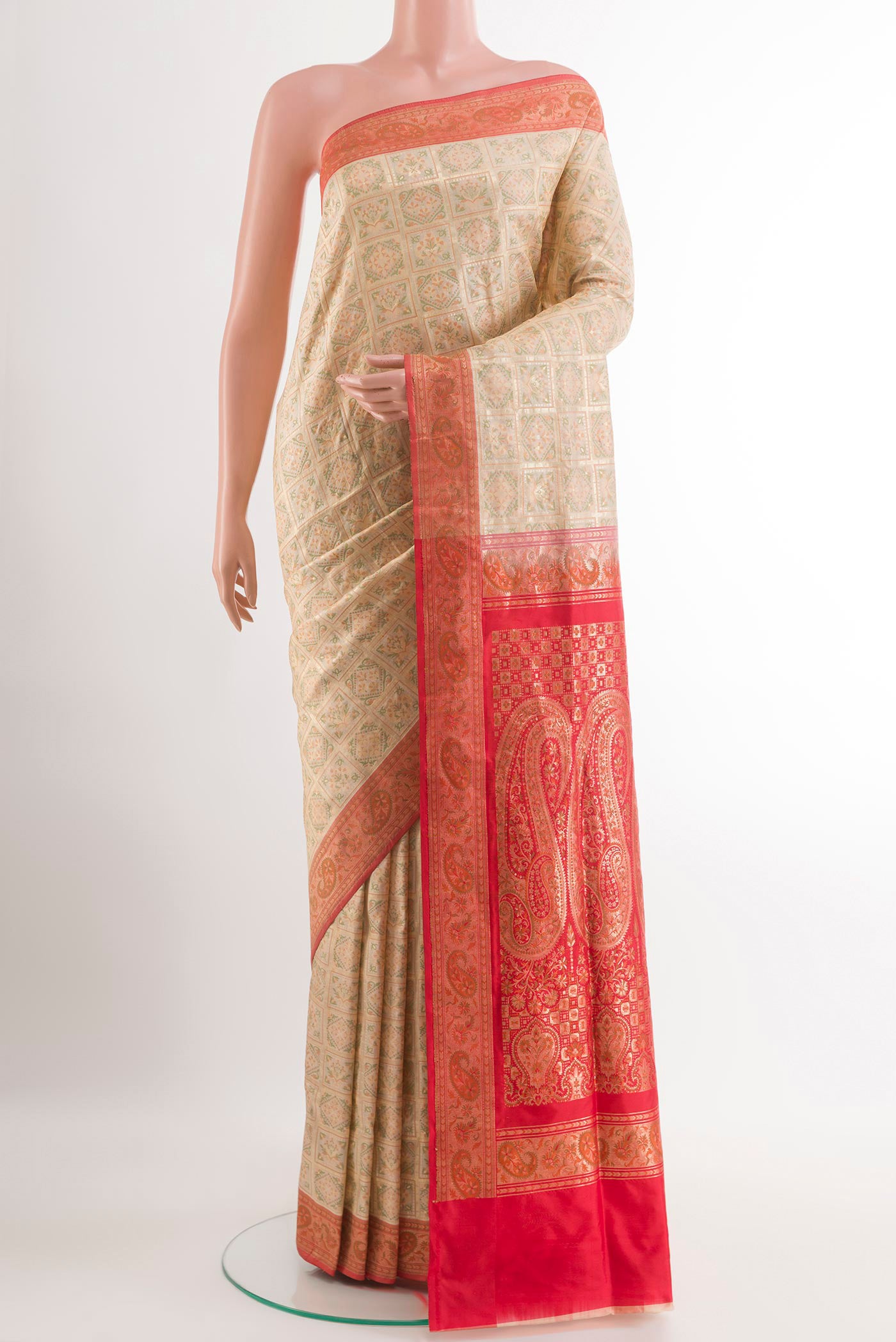 Cream Banarasi Jamavar Saree with Jacquard With Zari Butta on the body and Zari Border.  displayed on a mannequin