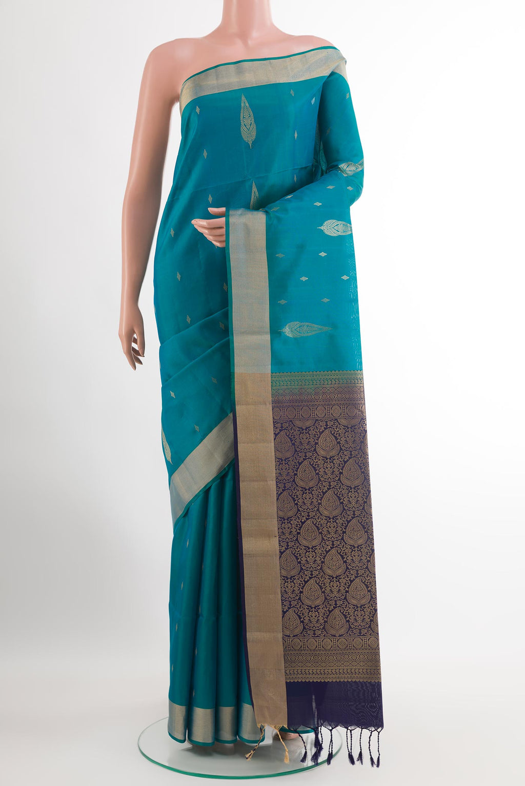 Blue Soft Silk Saree with Zari Butta on the body and Zari Border.  displayed on a mannequin
