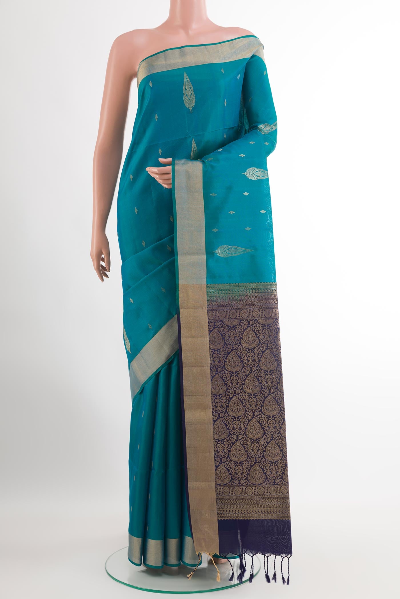 Blue Soft Silk Saree with Zari Butta on the body and Zari Border.  displayed on a mannequin