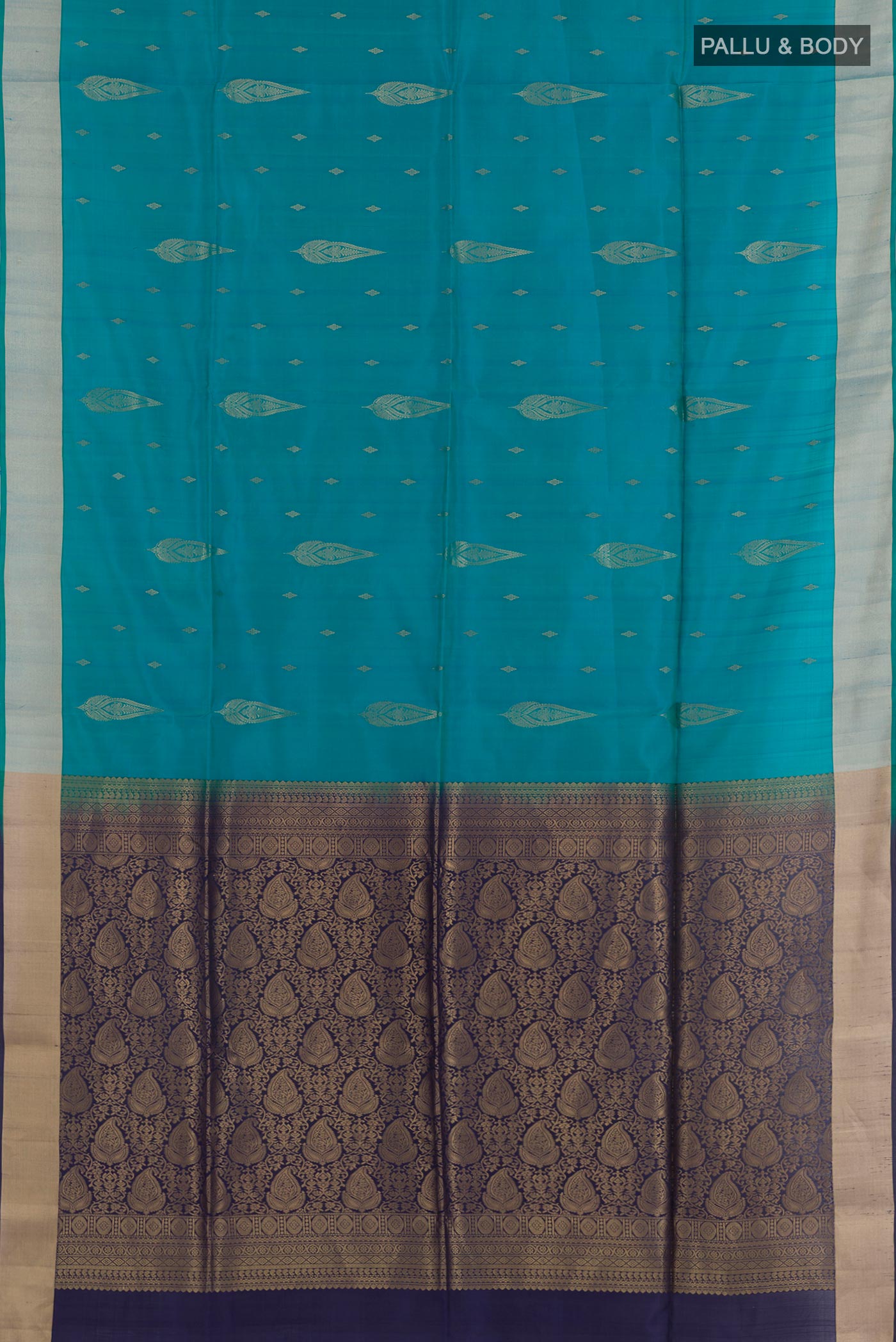 Flat view of Blue Soft Silk Saree with Zari Butta on the body and Zari Border. 