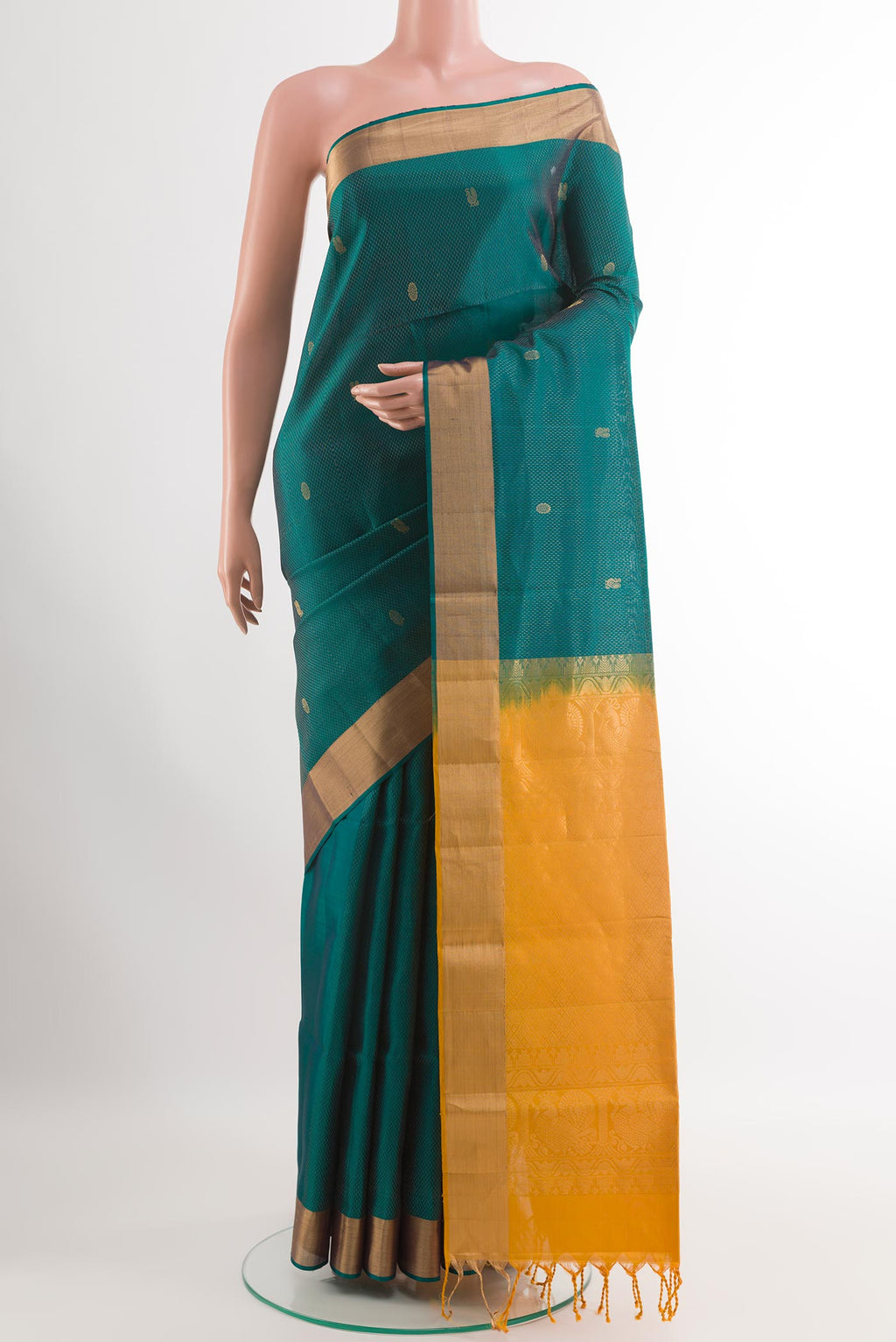 Sea Green Soft Silk Saree with Zari Butta on the body and Zari Border.  displayed on a mannequin