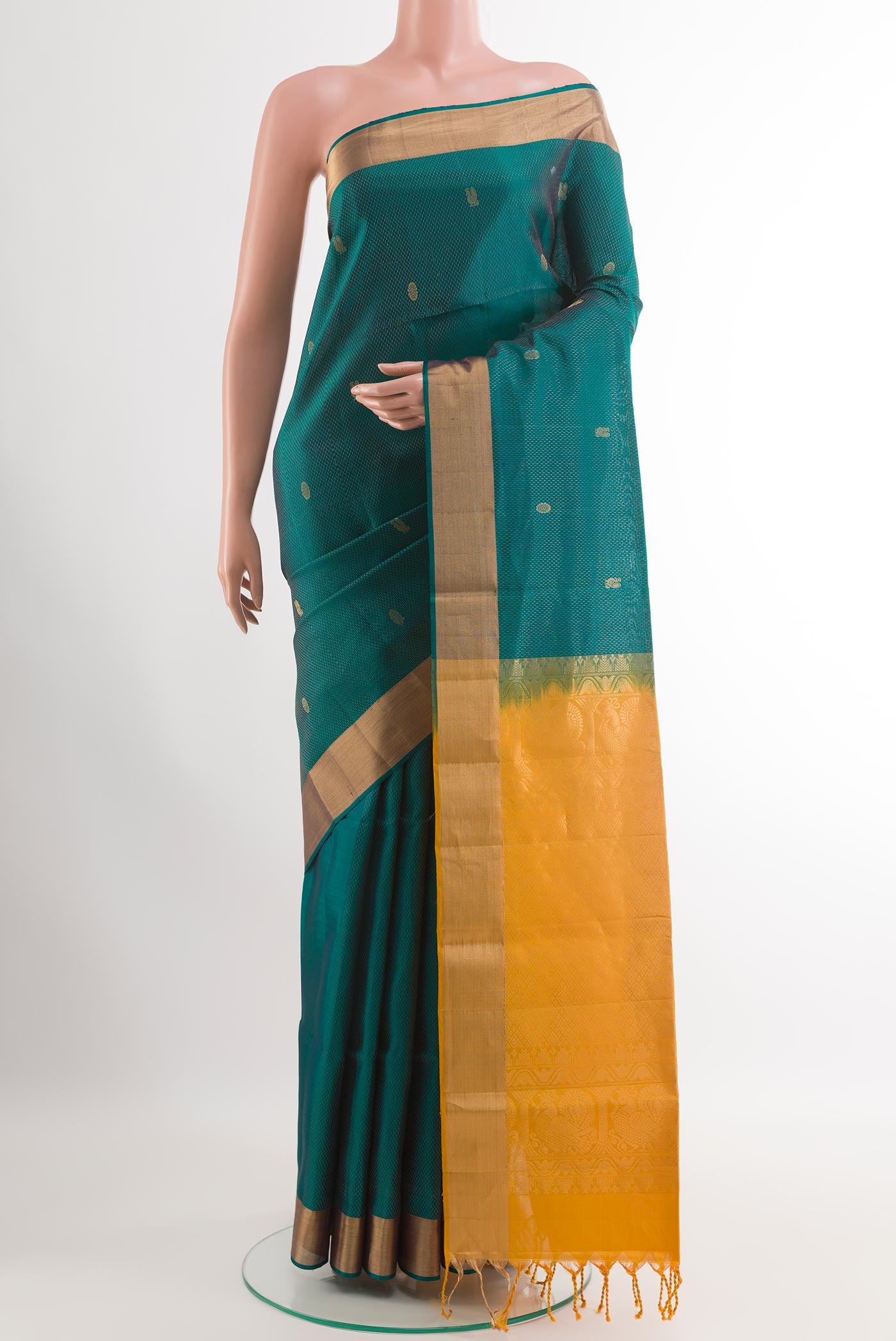 Sea Green Soft Silk Saree with Zari Butta on the body and Zari Border.  displayed on a mannequin