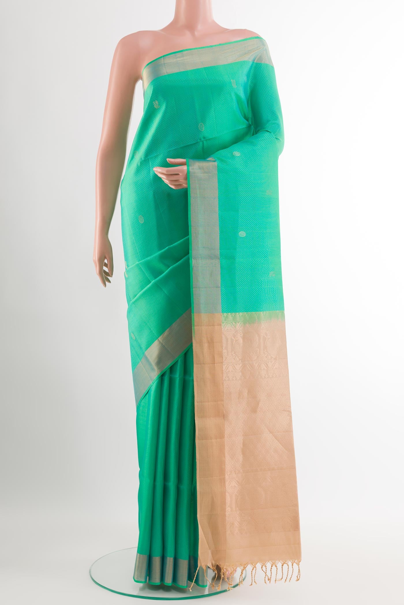 Sea Green Soft Silk Saree with Zari Butta on the body and Zari Border.  displayed on a mannequin