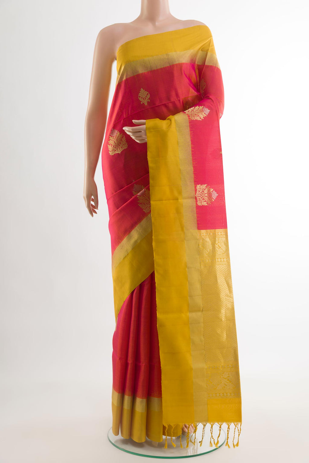 Pink Soft Silk Saree with Zari Butta on the body and Zari Border.  displayed on a mannequin