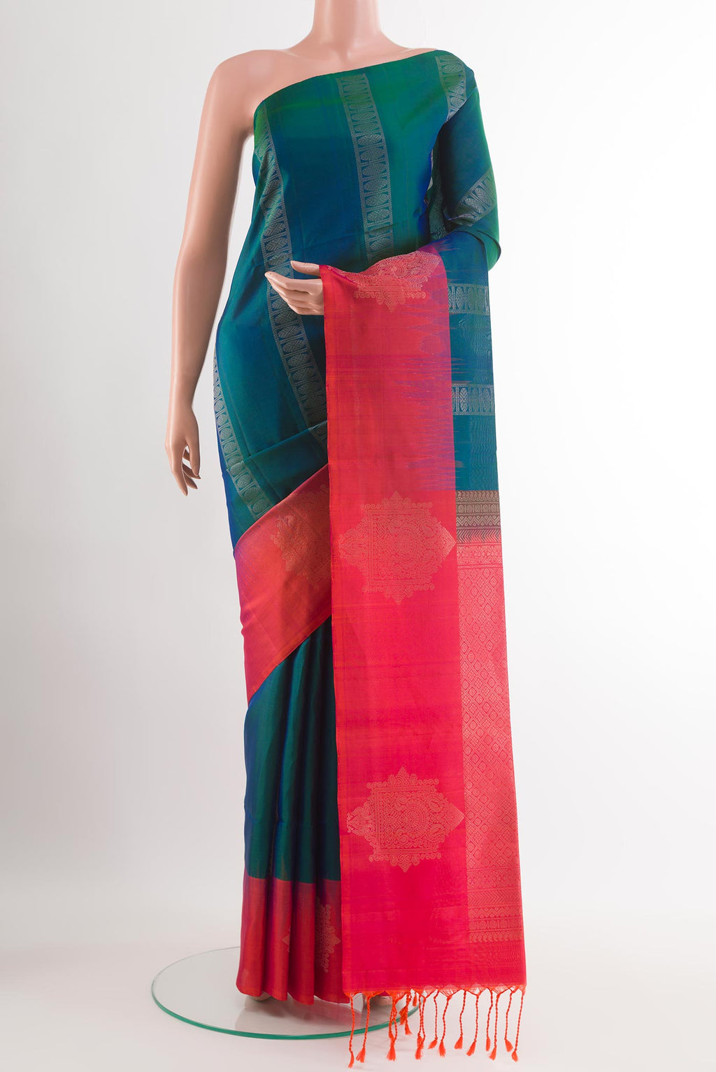 Peacock Blue Dual Tone Soft Silk Saree with Zari Butta on the body and Zari Border.  displayed on a mannequin