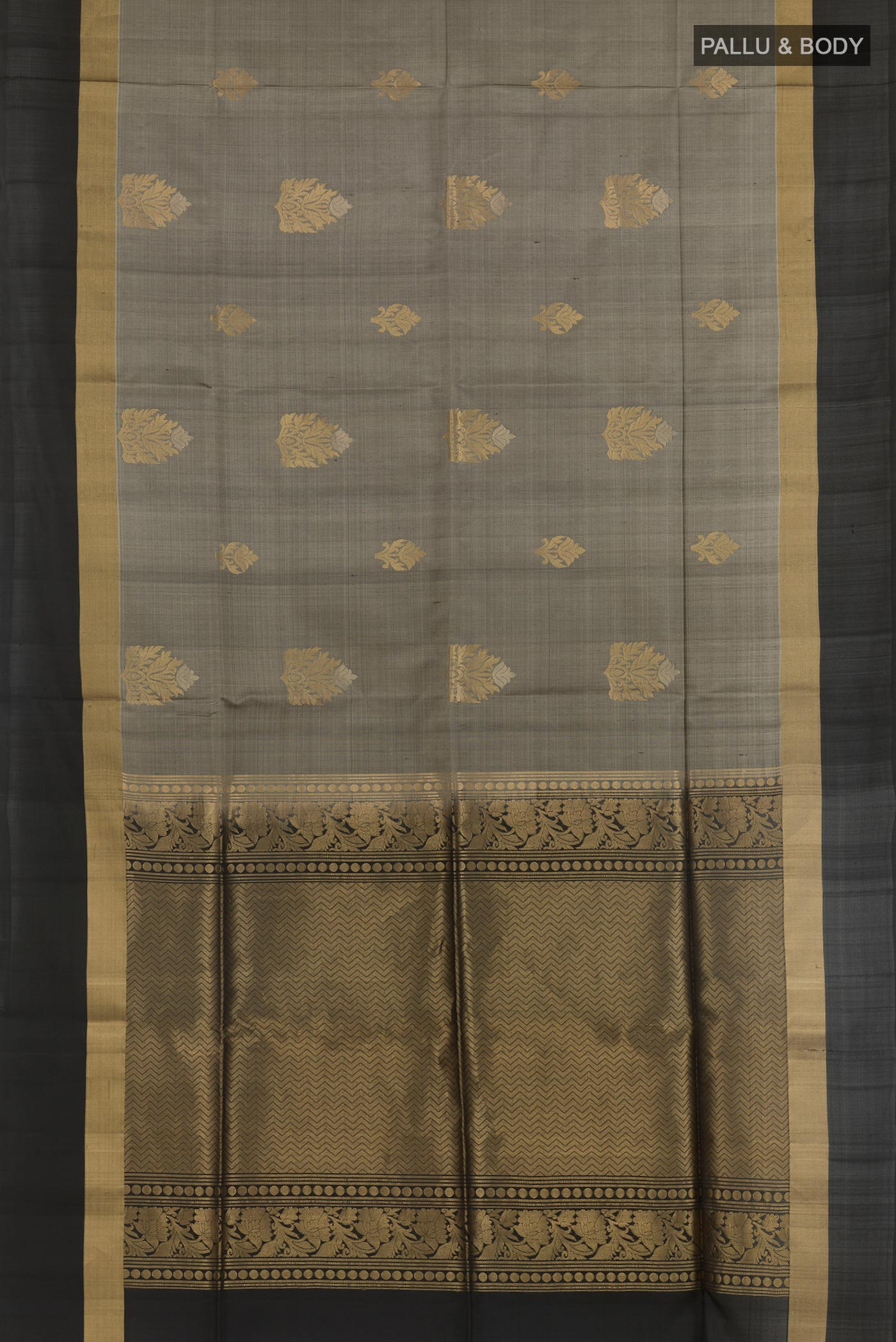 Flat view of Grey Soft Silk Saree with Zari Butta on the body and Zari Border. 