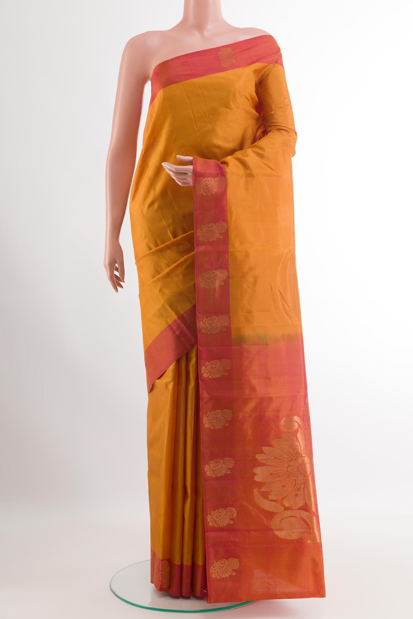 Mustard Kanjivaram Silk Saree with Stripes on the body and Zari Border.  displayed on a mannequin