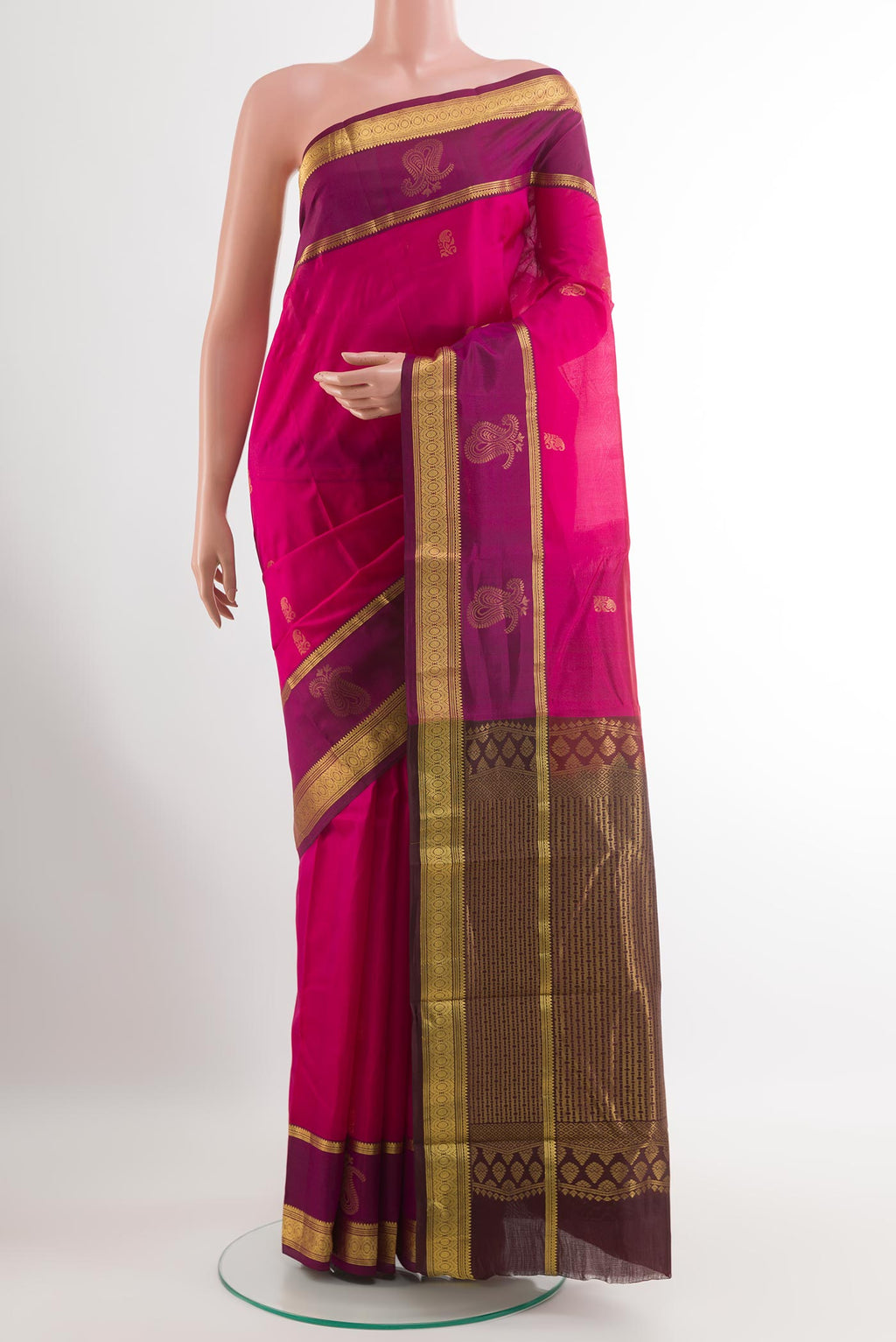 Pink Kanjivaram Silk Saree with Zari Butta on the body and Zari Border.  displayed on a mannequin