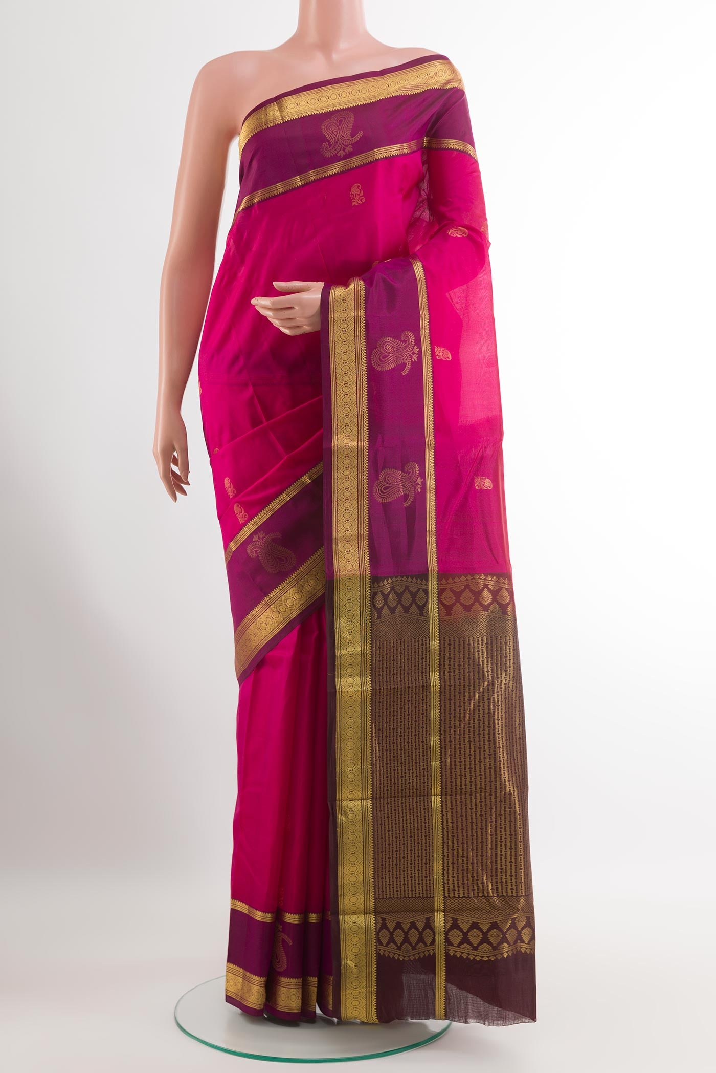 Pink Kanjivaram Silk Saree with Zari Butta on the body and Zari Border.  displayed on a mannequin