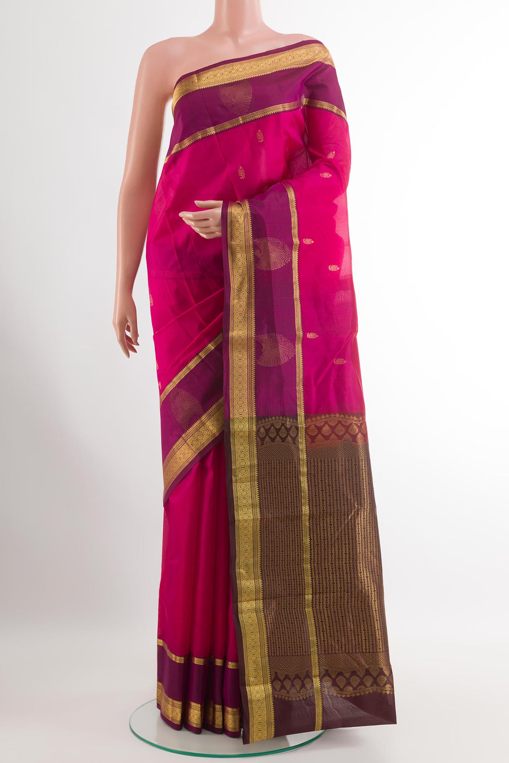 Pink Kanjivaram Silk Saree with Zari Butta on the body and Zari Border.  displayed on a mannequin