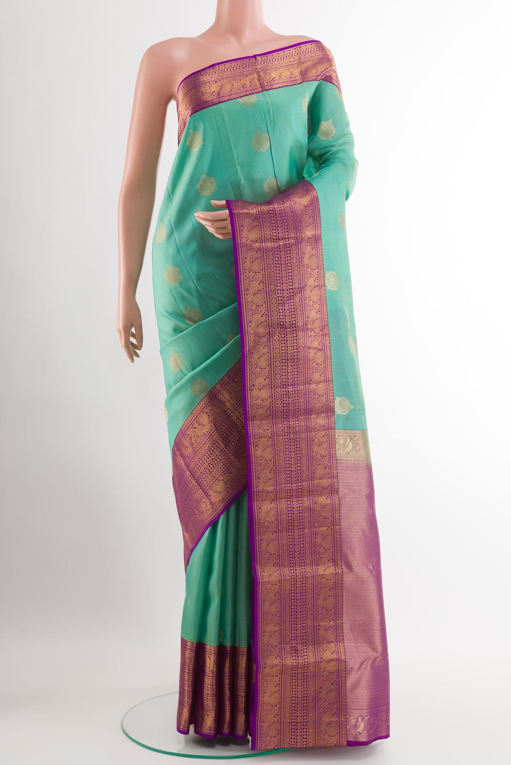 Sea Green Kanchipuram Silk Saree with Zari Butta on the body and Paithani Border.  displayed on a mannequin
