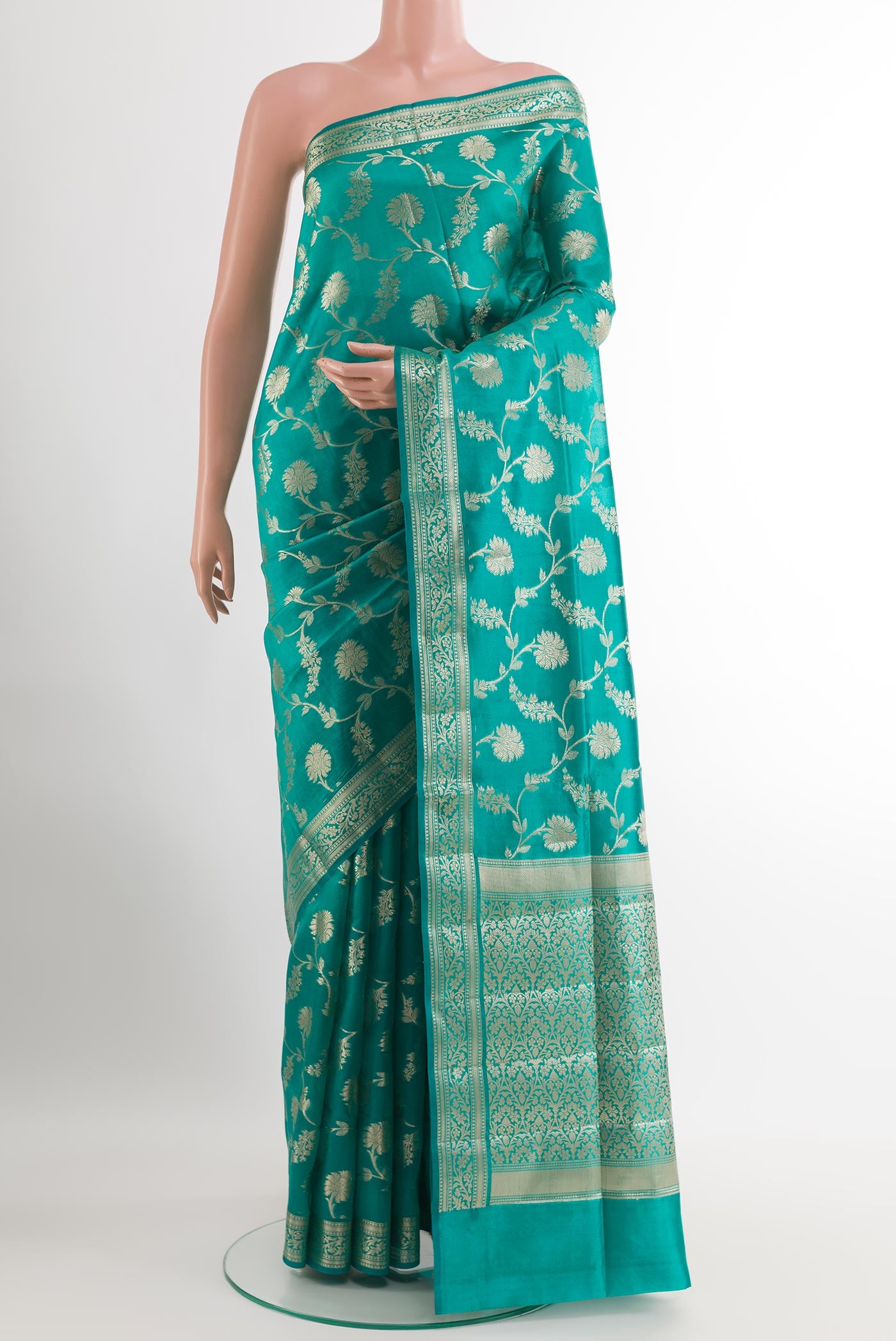 Sea Green Banarasi Tussar Silk Saree with Zari Brocade on the body and Zari Border.  displayed on a mannequin