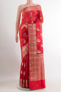 Red Tussar Silk Saree with Zari Butta on the body and Zari Border.  displayed on a mannequin