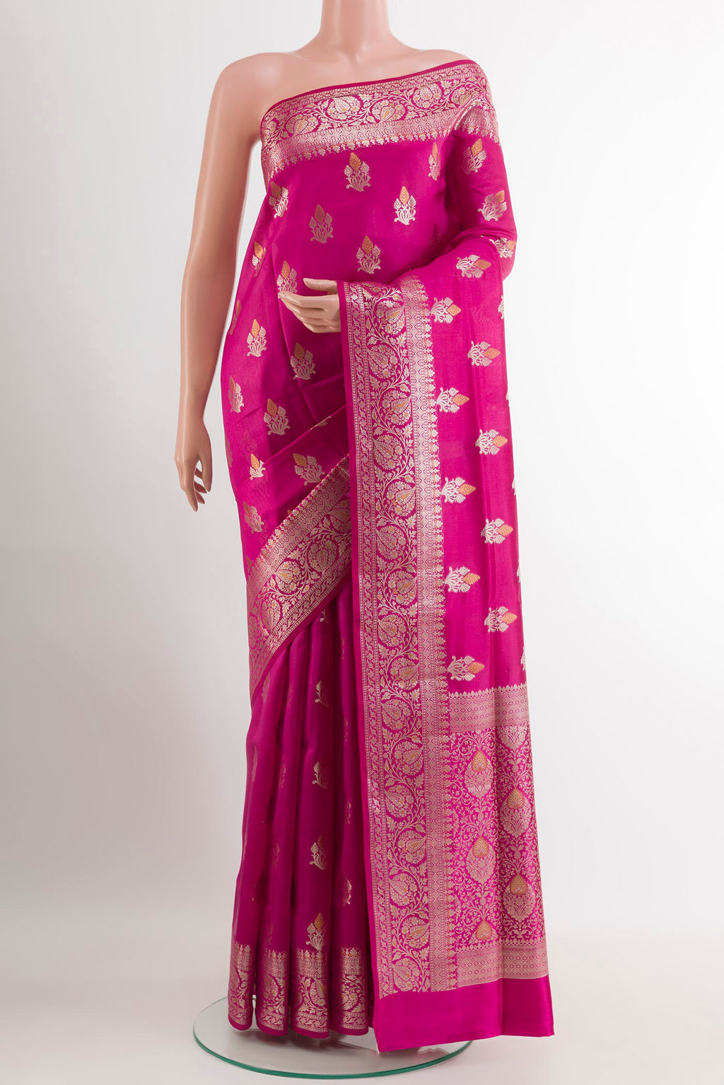 Rani Pink Tussar Silk Saree with Zari Butta on the body and Zari Border.  displayed on a mannequin