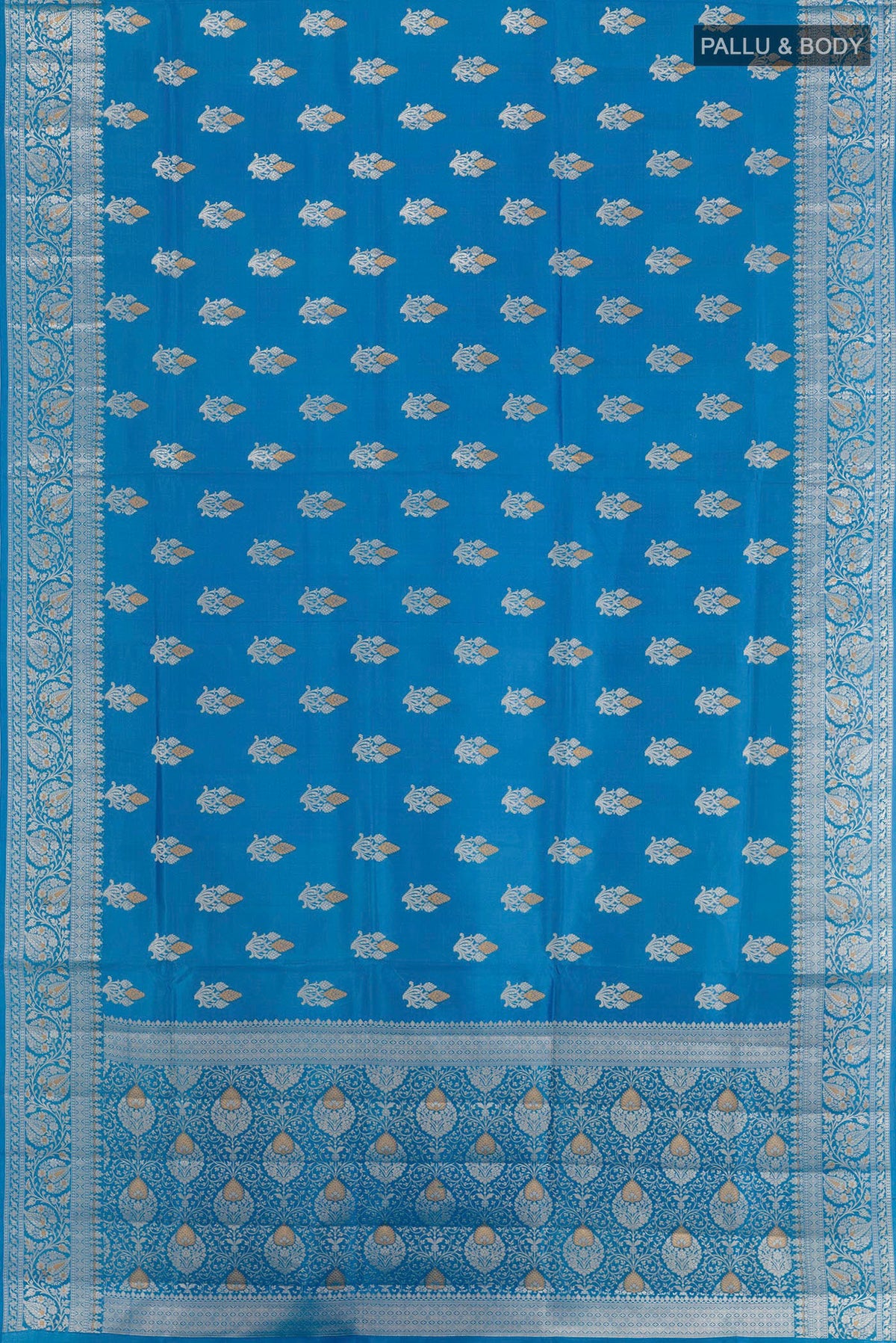 Flat view of Blue Tussar Silk Saree with Zari Butta on the body and Zari Border. 