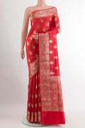 Red Tussar Silk Saree with Zari Butta on the body and Zari Border.  displayed on a mannequin
