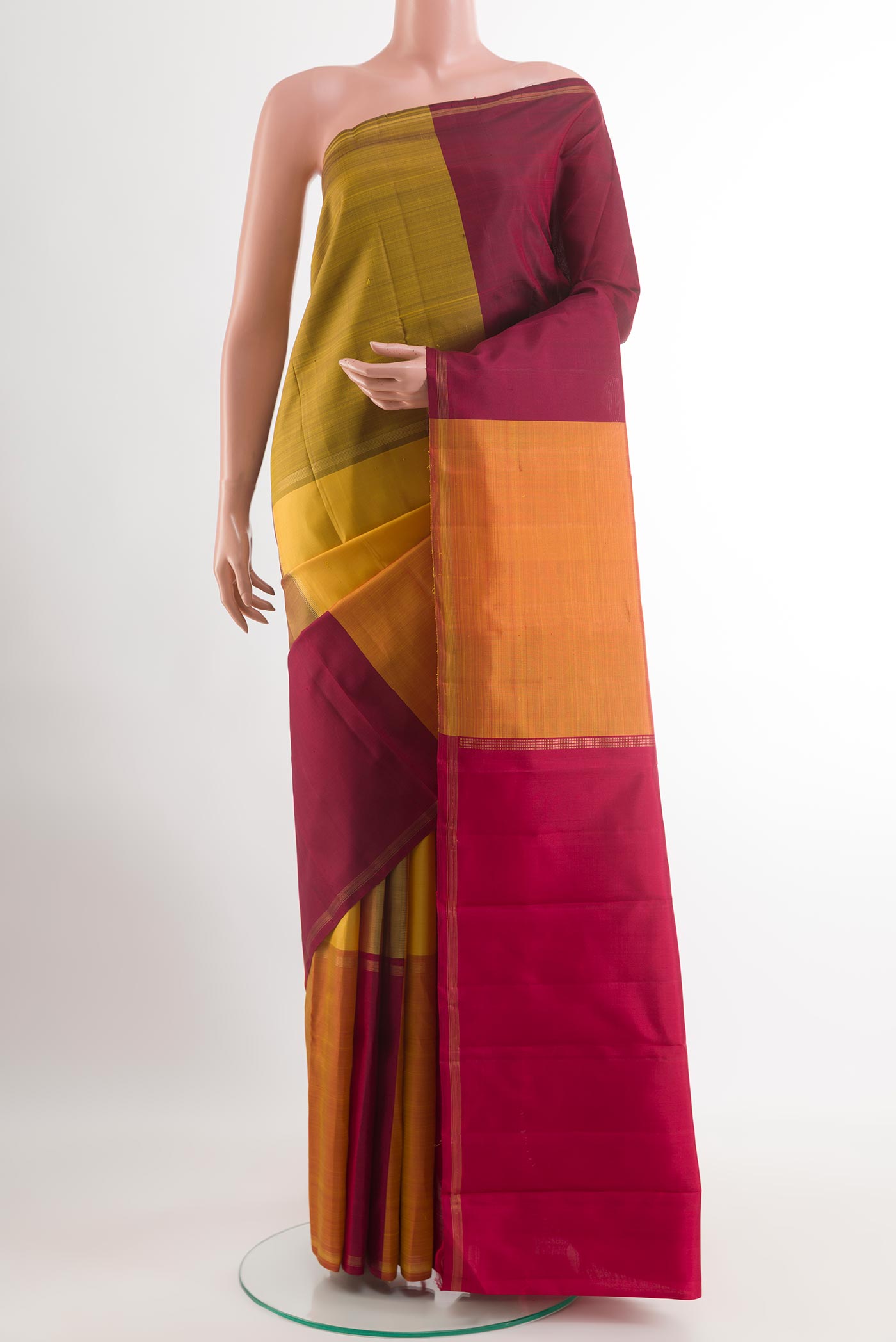 Multi Color Kanjivaram Silk Saree with Stripes on the body and Zari Border.  displayed on a mannequin