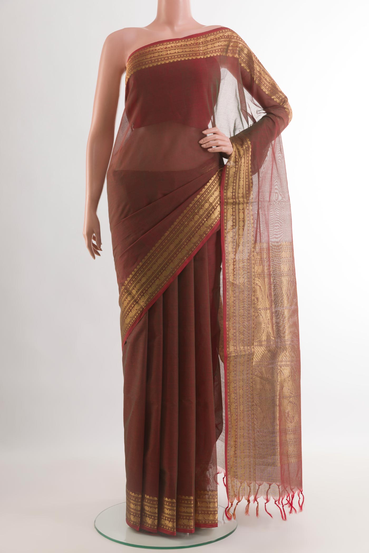Brown Coimbatore Cotton Saree with Plain Body and Zari Border.  displayed on a mannequin