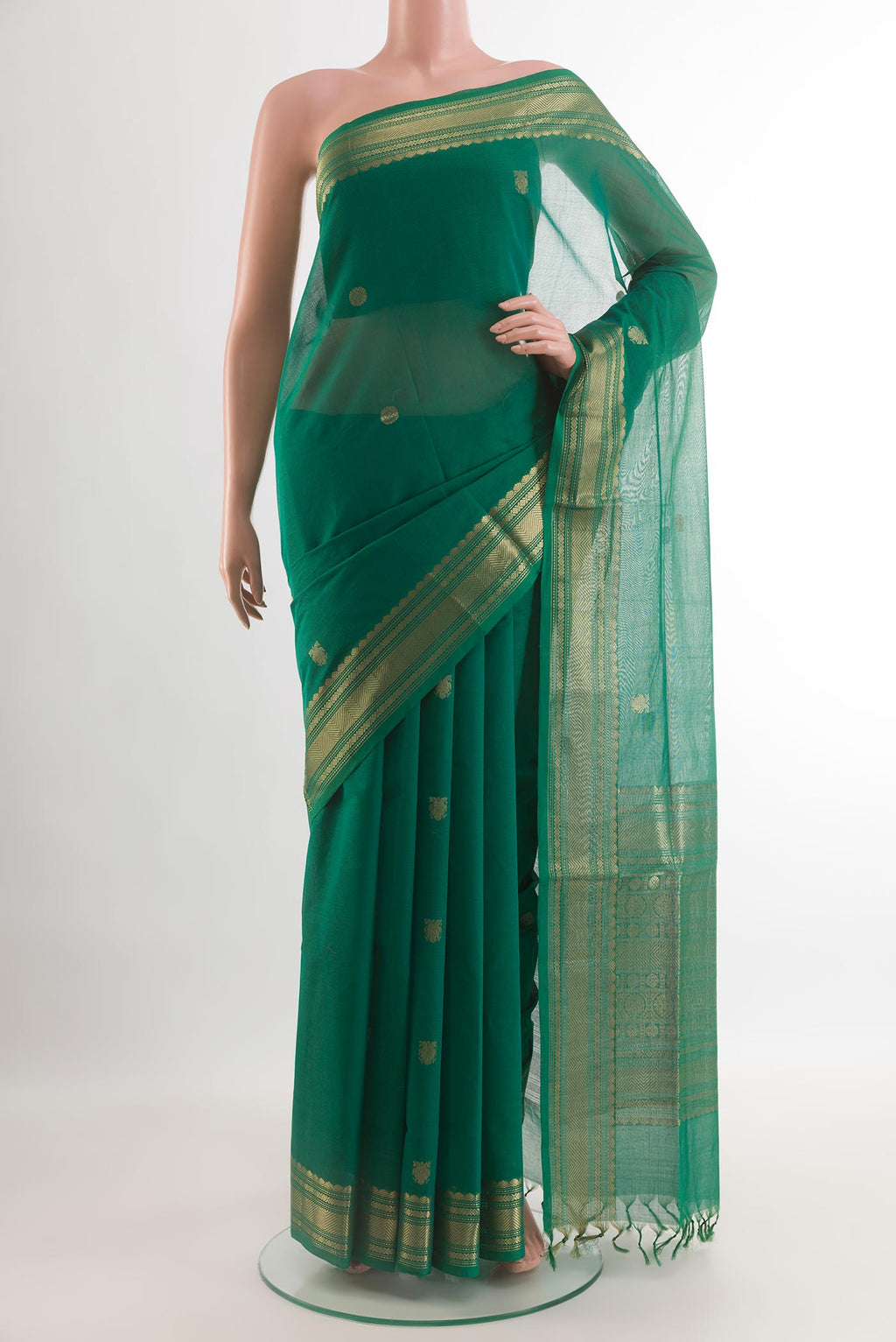Teal Coimbatore Cotton Saree with Zari Butta on the body and Zari Border.  displayed on a mannequin