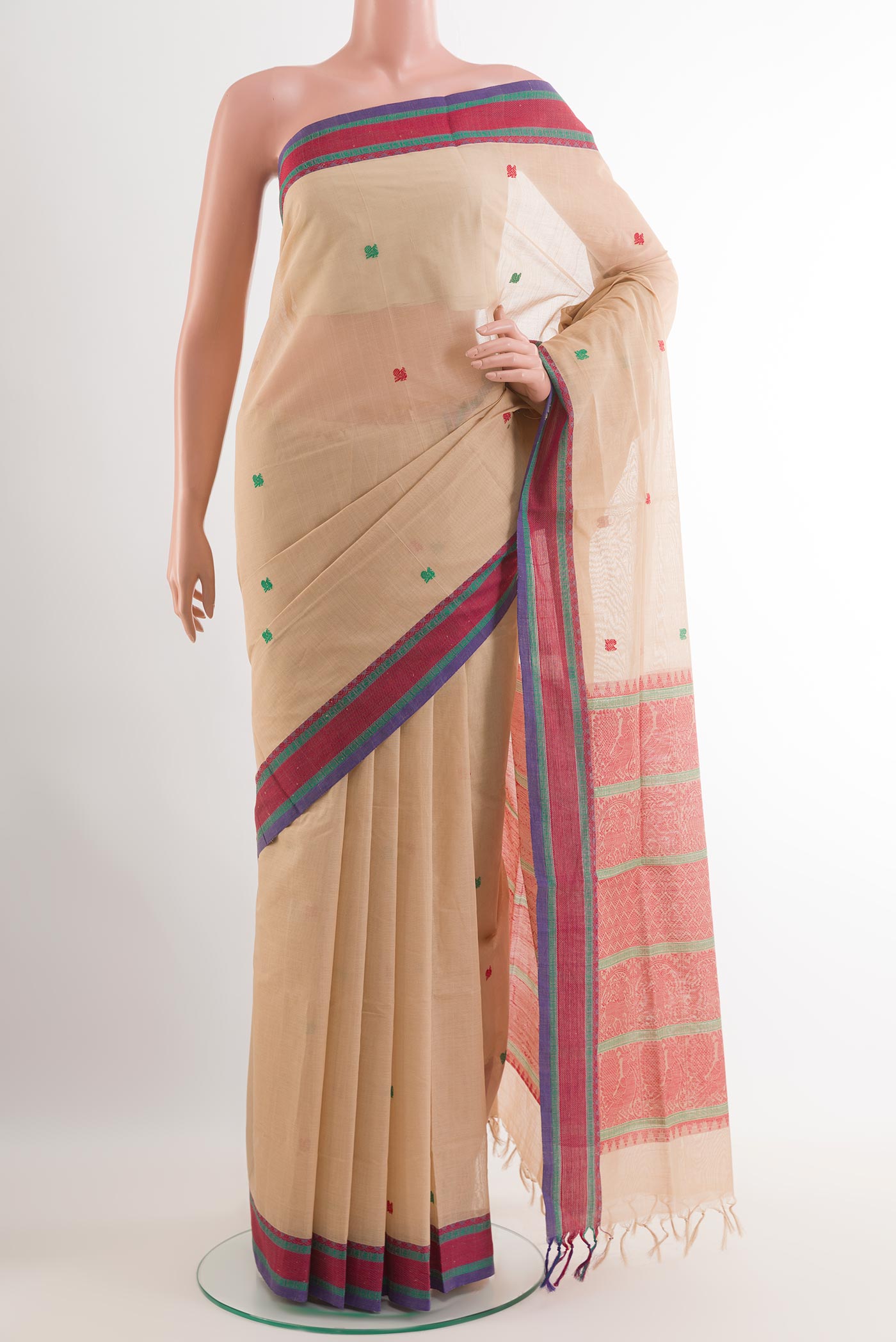 Beige Blended Kora Cotton Saree with Thread Butta on the body and Zari Border.  displayed on a mannequin