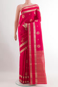 Red Kanjivaram Silk Saree with Zari Butta on the body and Zari Border.  displayed on a mannequin