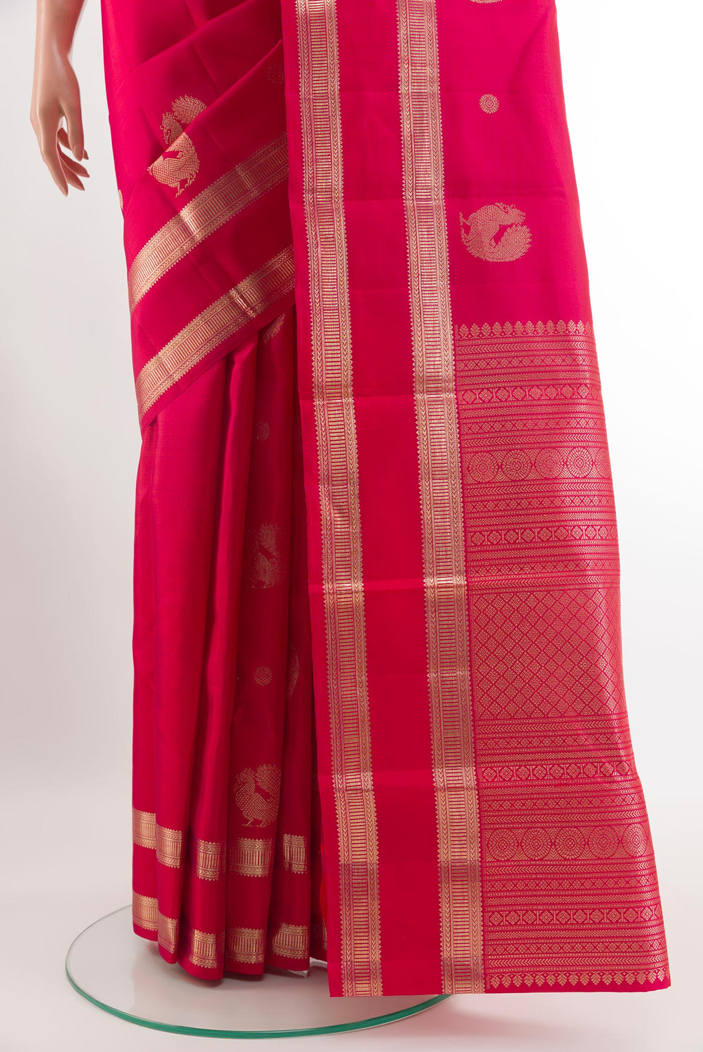 Pleats and pallu of Red Kanjivaram Silk Saree with Zari Butta on the body and Zari Border. 