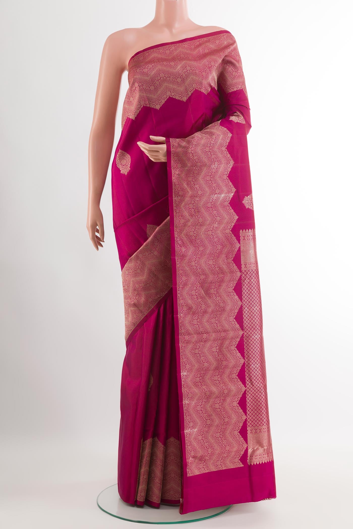 Light Magenta Kanjivaram Silk Saree with Zari Butta on the body and Zari Border.  displayed on a mannequin
