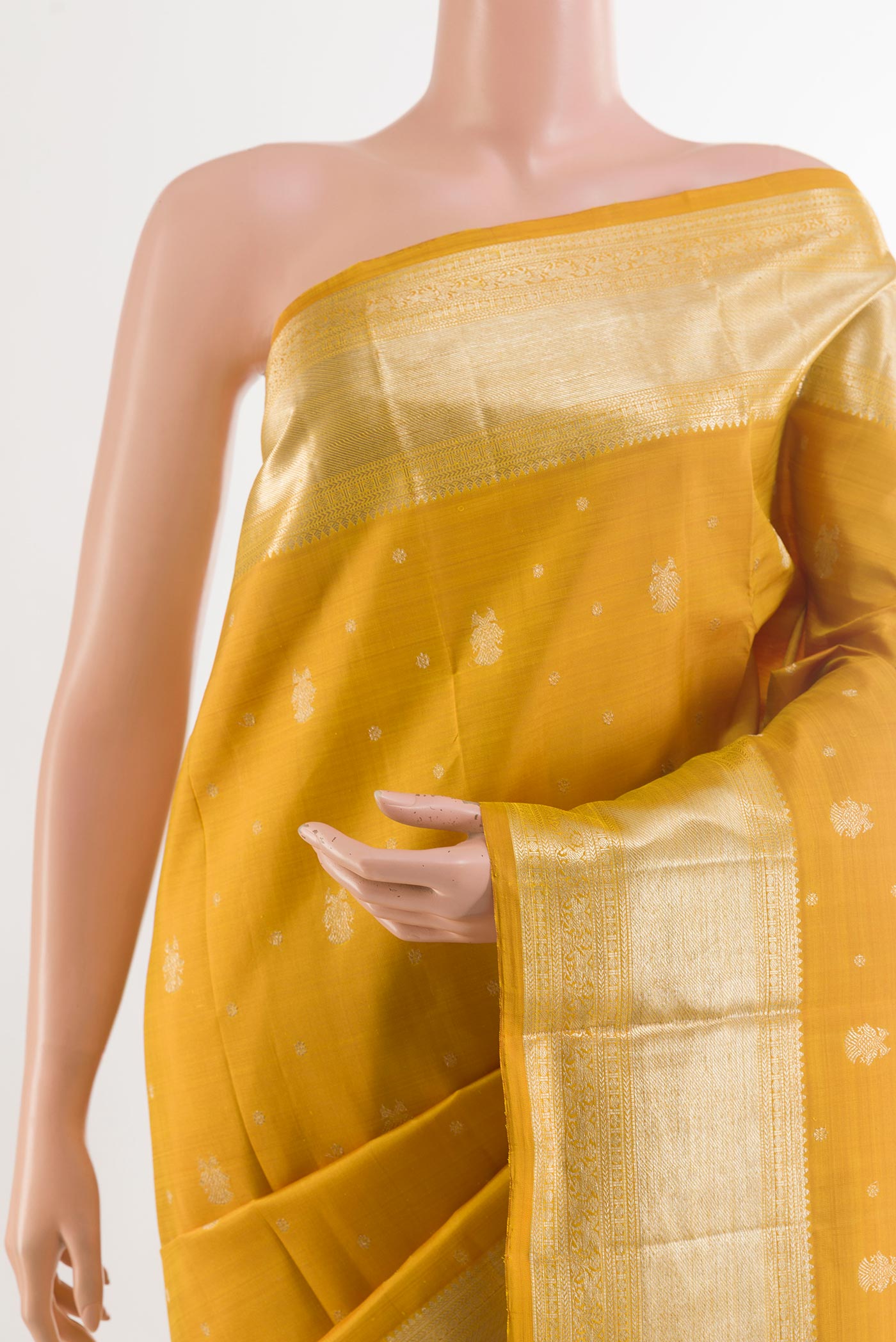 Border image of Yellow Kanjivaram Silk Saree with Zari Butta on the body and Zari Border. 