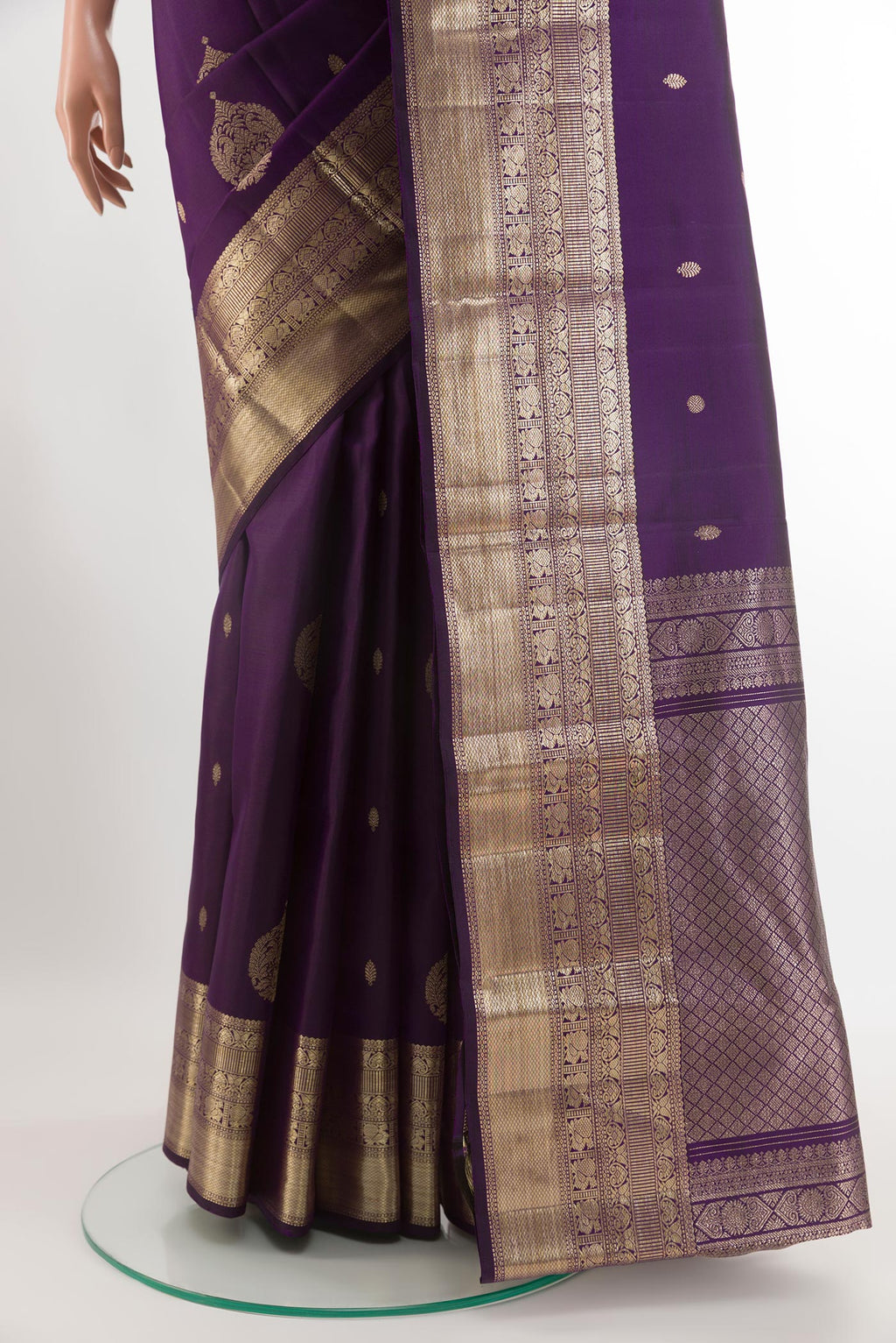 Pleats and pallu of Purple Kanjivaram Silk Saree with Zari Butta on the body and Zari Border. 